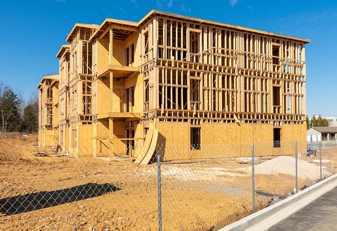 a snapshot of temporary chain link fences protecting a large construction project from unauthorized access in Elbridge